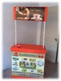 Stand Publicitario de Café color naranja Rotulado